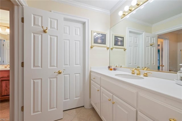 bathroom featuring ornamental molding, vanity, and tile patterned floors