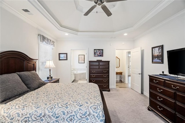 bedroom with crown molding, ensuite bath, a raised ceiling, and light carpet