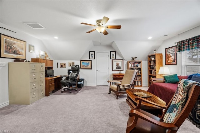 home office featuring ceiling fan, lofted ceiling, and light carpet