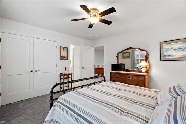 bedroom with dark carpet, a closet, and ceiling fan