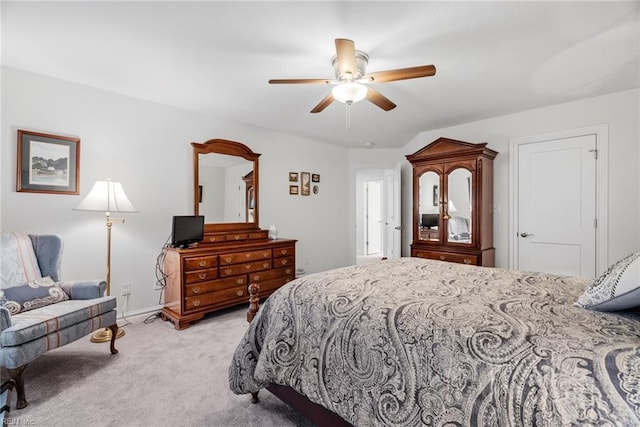 bedroom featuring light carpet and ceiling fan