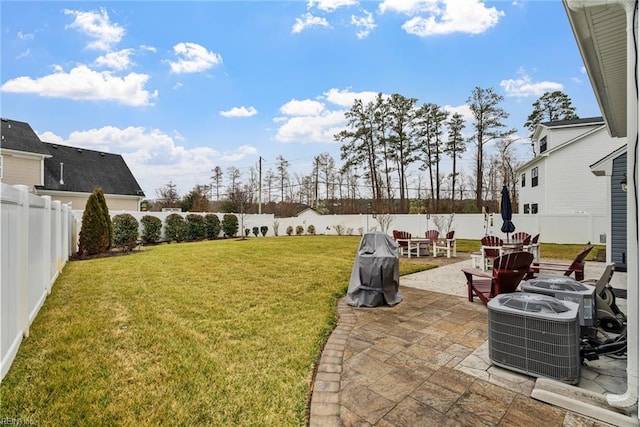 view of yard with cooling unit and a patio