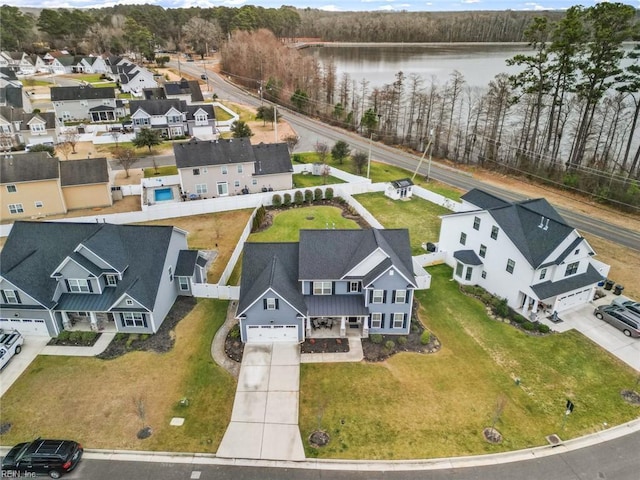 drone / aerial view with a water view