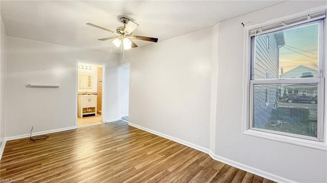 empty room featuring ceiling fan and wood-type flooring