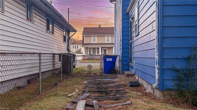 view of yard at dusk