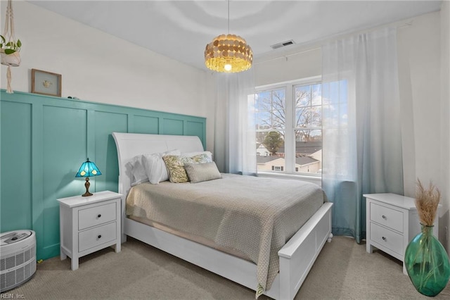 bedroom featuring light colored carpet