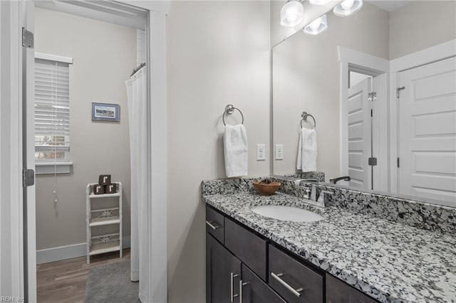 bathroom featuring vanity and hardwood / wood-style floors