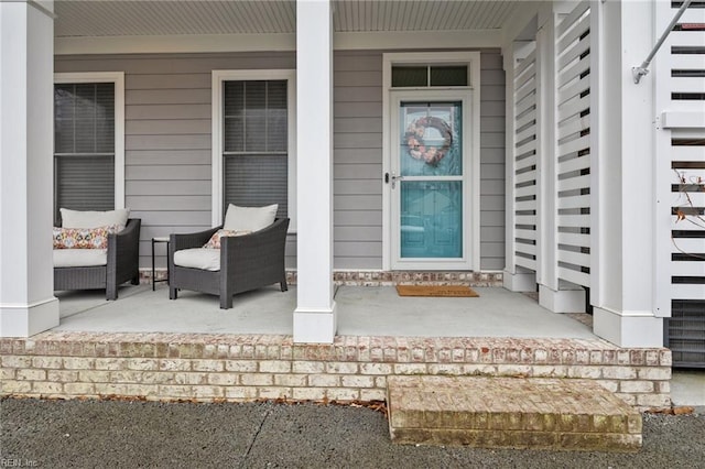 view of exterior entry featuring a porch