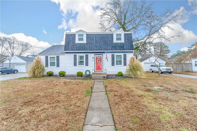 view of front of house featuring a garage and a front yard