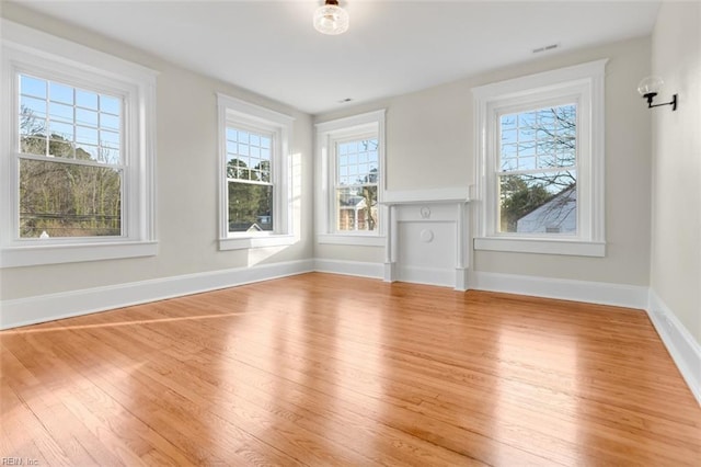 unfurnished living room with light hardwood / wood-style floors