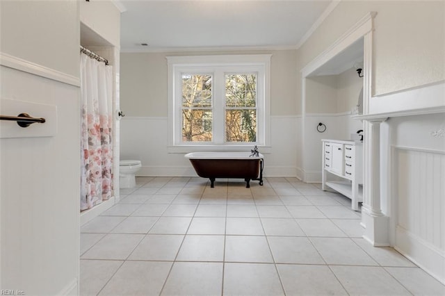 bathroom with ornamental molding, tile patterned floors, and toilet