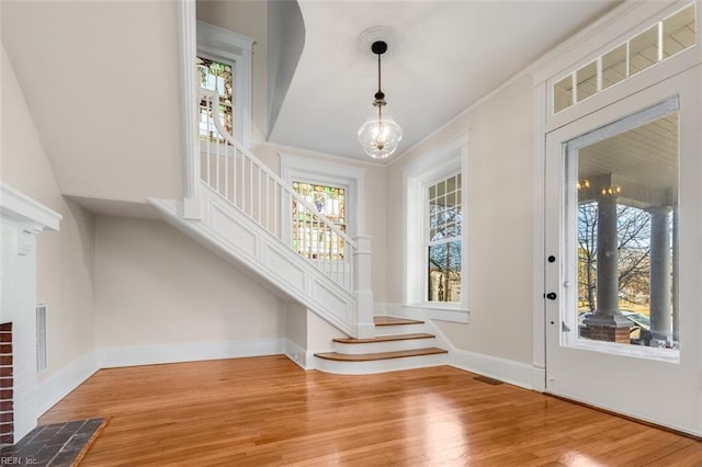 entrance foyer with a chandelier and hardwood / wood-style floors