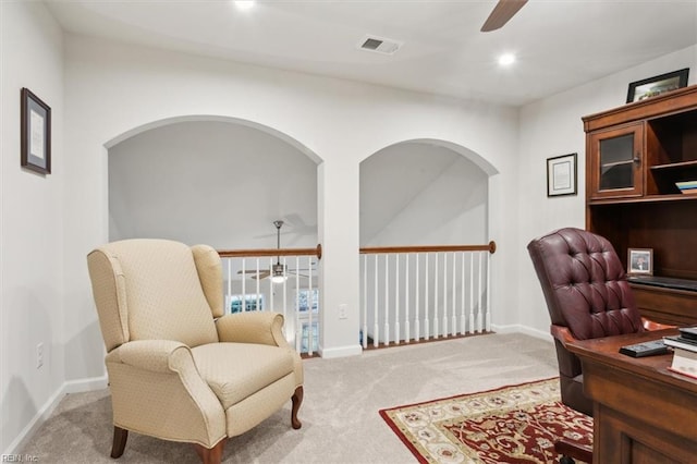 carpeted home office with ceiling fan