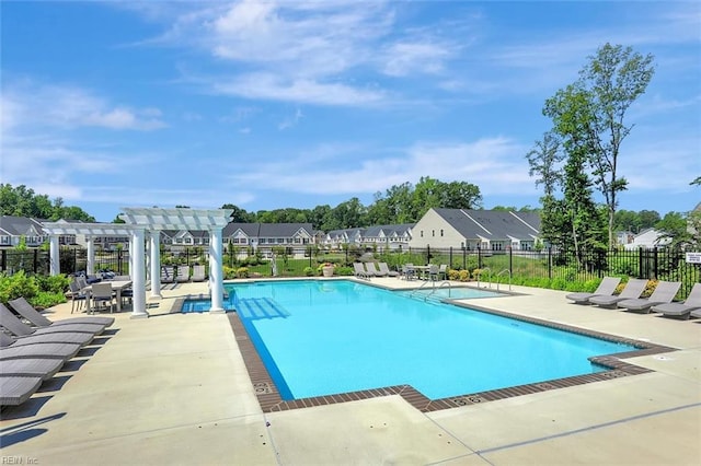 view of swimming pool with a patio and a pergola