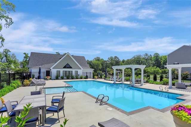 view of swimming pool with a pergola and a patio area