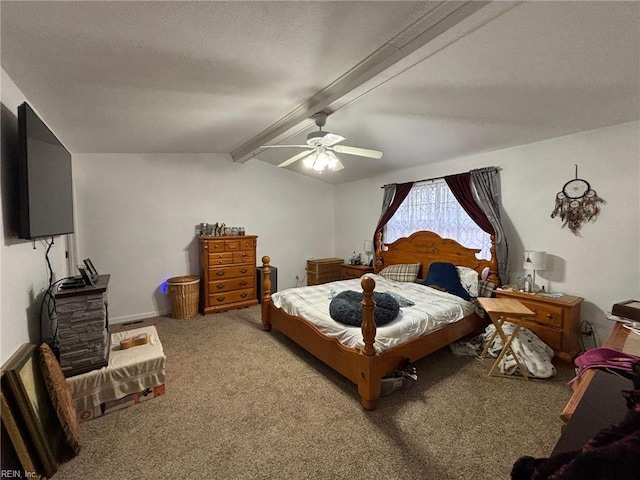 bedroom with ceiling fan, lofted ceiling with beams, carpet floors, and a textured ceiling
