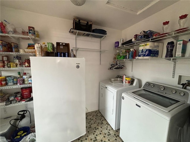 laundry area with washing machine and clothes dryer