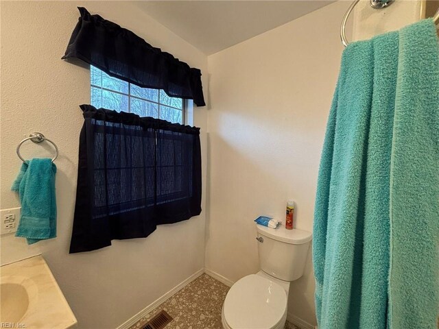 bathroom featuring toilet