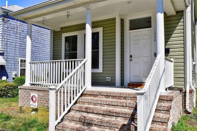 property entrance featuring covered porch