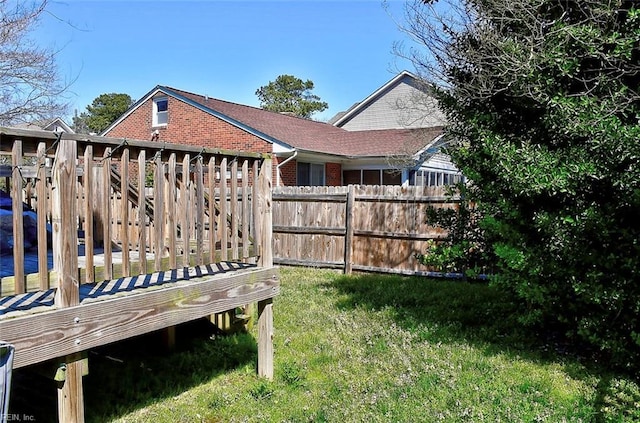 view of yard with a wooden deck