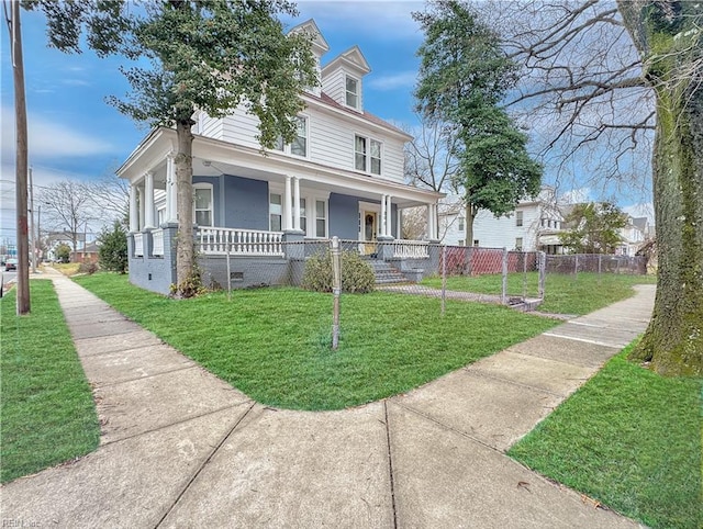 view of front of home featuring a front yard and a porch