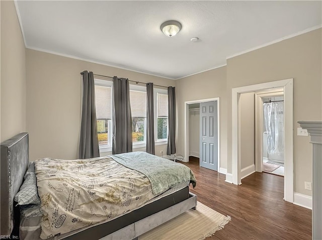 bedroom featuring crown molding, dark hardwood / wood-style floors, and a closet