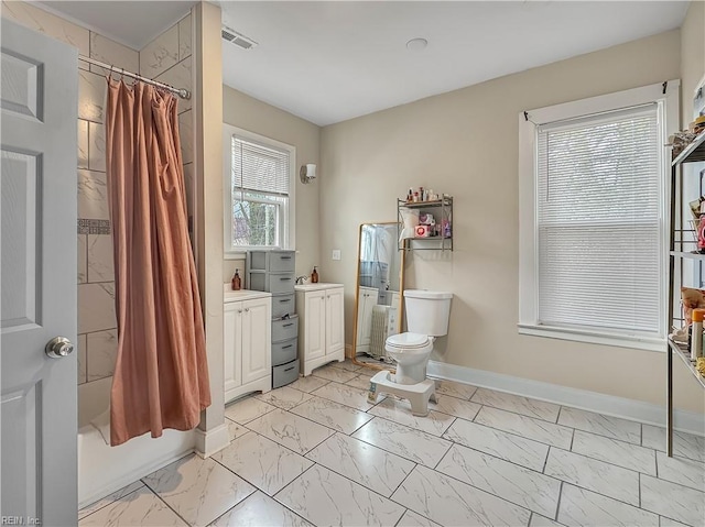 full bathroom featuring vanity, toilet, and shower / bath combo