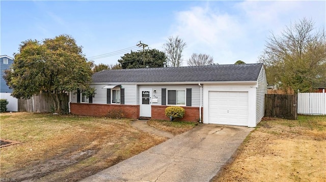 ranch-style home with a garage and a front lawn