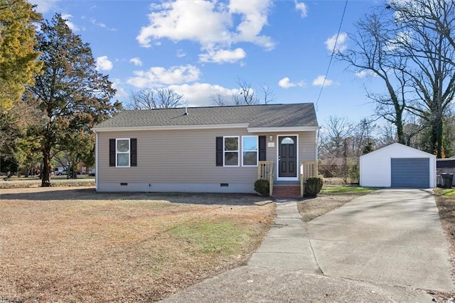 view of front of property featuring an outbuilding, a garage, and a front yard