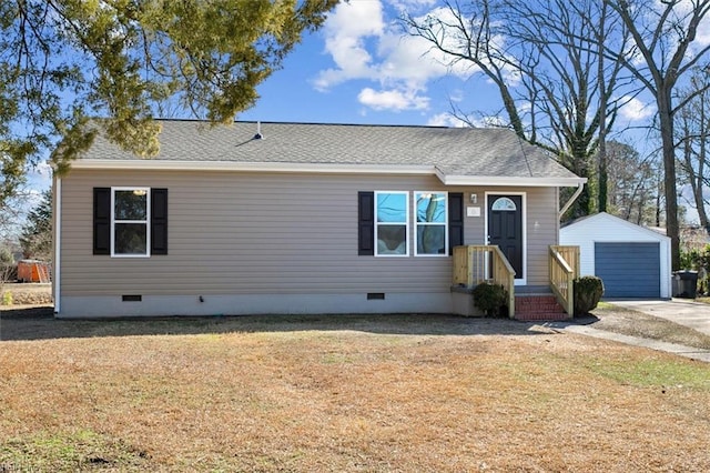 view of front of house with a garage and an outdoor structure