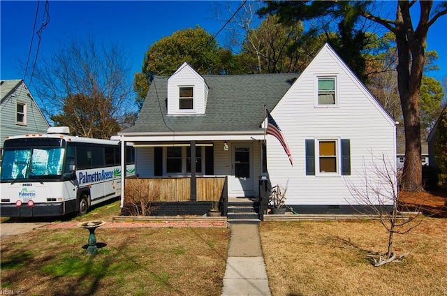 view of front of home featuring covered porch and a front yard