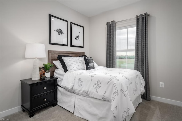 bedroom with light colored carpet