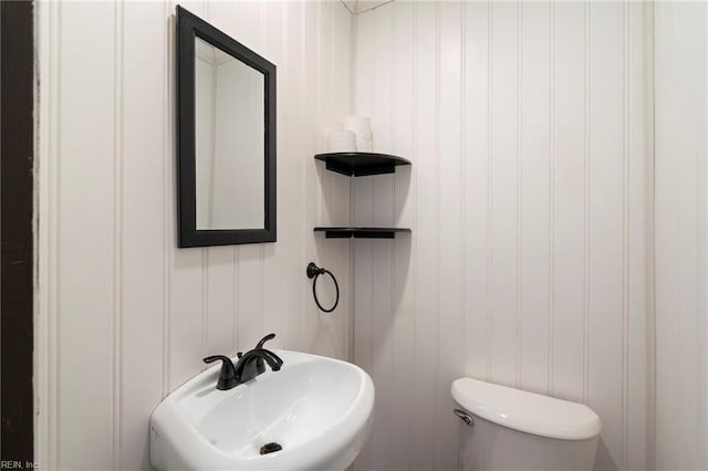 bathroom with sink and toilet