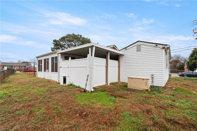 view of home's exterior featuring a lawn