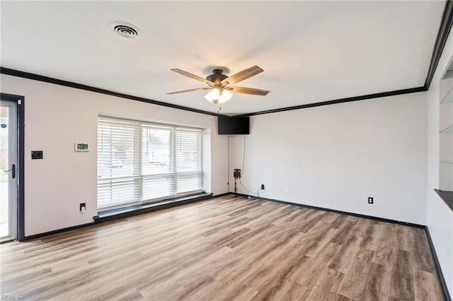 unfurnished room with crown molding and light hardwood / wood-style flooring