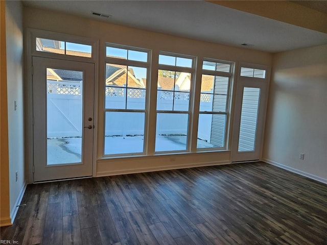 doorway to outside featuring dark hardwood / wood-style flooring