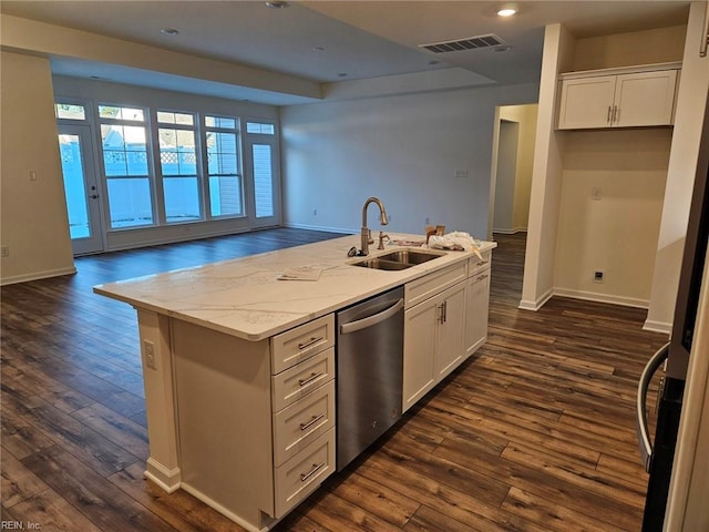 kitchen featuring white cabinetry, dishwasher, sink, and an island with sink