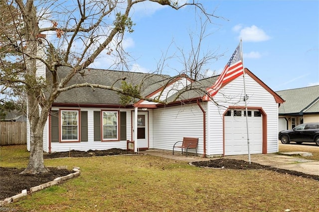 ranch-style home featuring a garage and a front yard