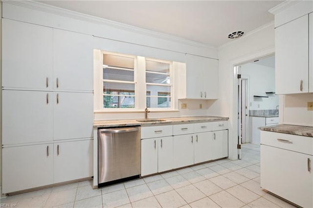 kitchen with light tile patterned floors, sink, dishwasher, ornamental molding, and white cabinets