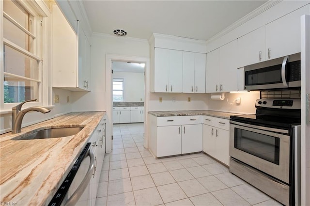 kitchen with white cabinetry, appliances with stainless steel finishes, and sink