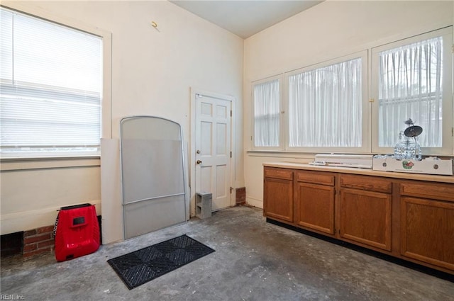 interior space featuring vanity and concrete floors