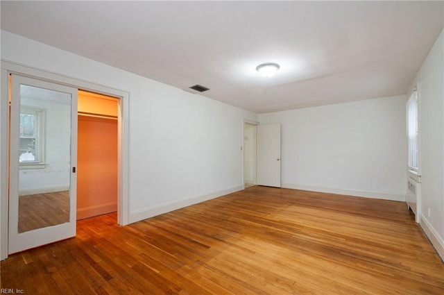 unfurnished bedroom featuring wood-type flooring