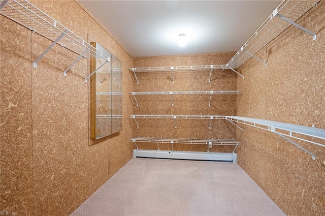 walk in closet featuring baseboard heating