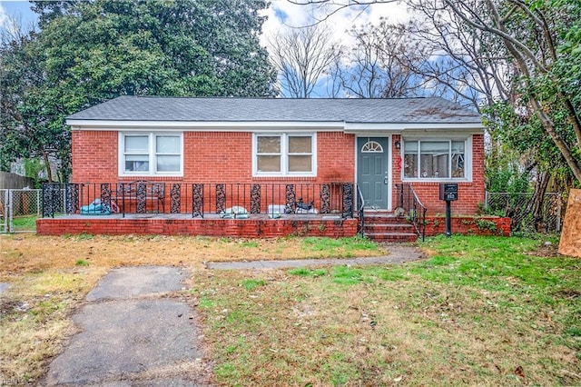 ranch-style home with a front yard