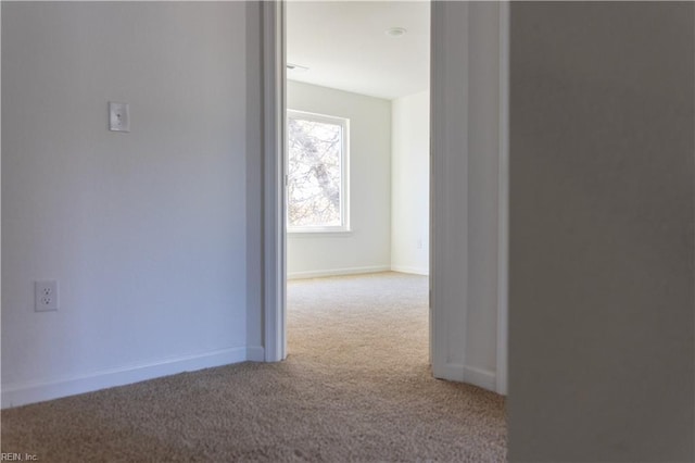 corridor featuring light carpet