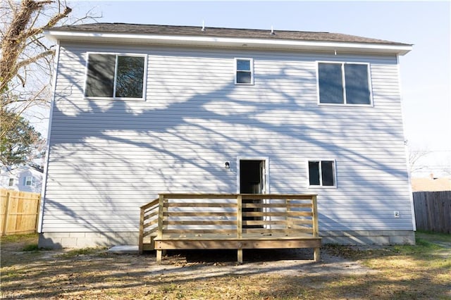 rear view of house with a wooden deck