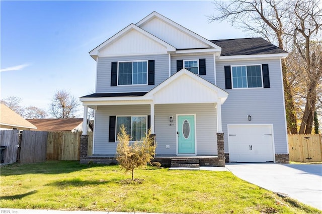 craftsman inspired home with a garage, a front lawn, and covered porch