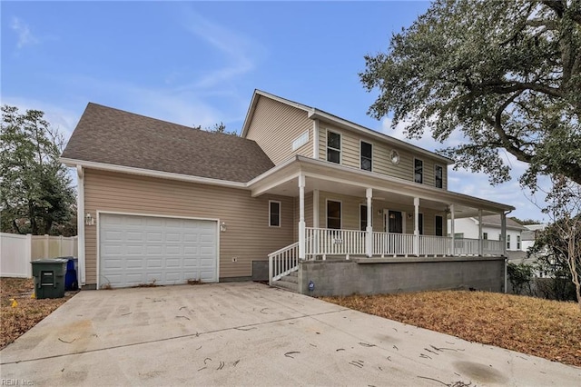 view of front of property featuring a garage and a porch