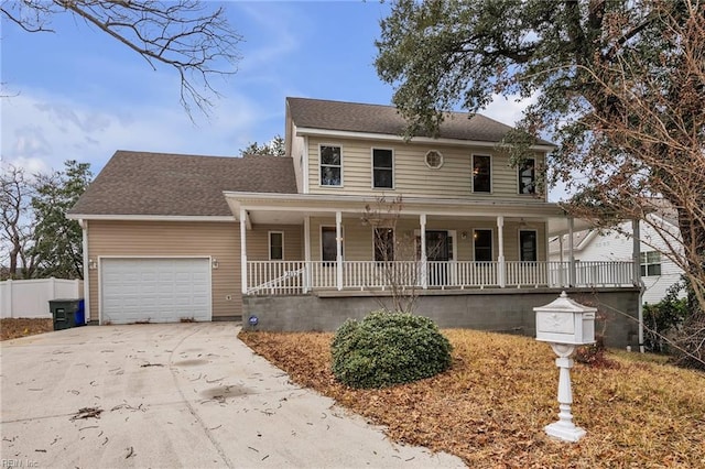 view of front facade featuring a garage and covered porch