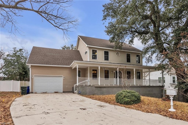 view of front facade featuring a garage and covered porch